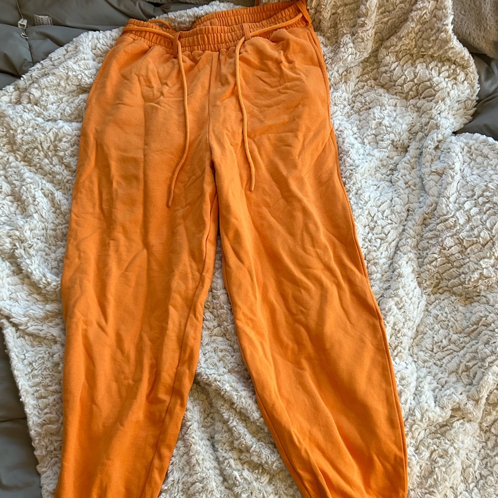 Orange collusion sweatpants with lace belt waist